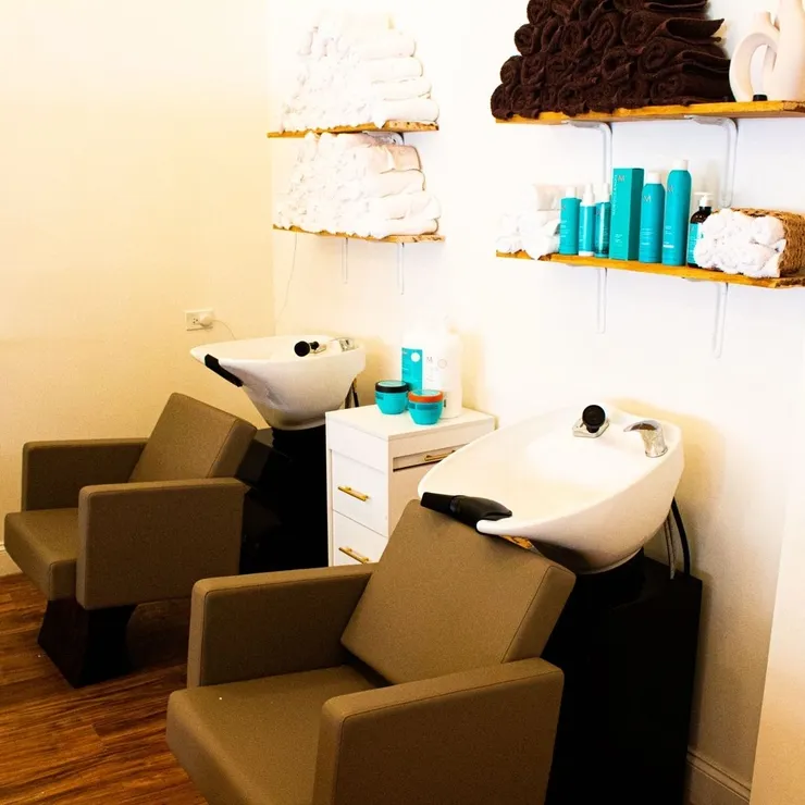 Comfortable salon chairs at the hair washing stations